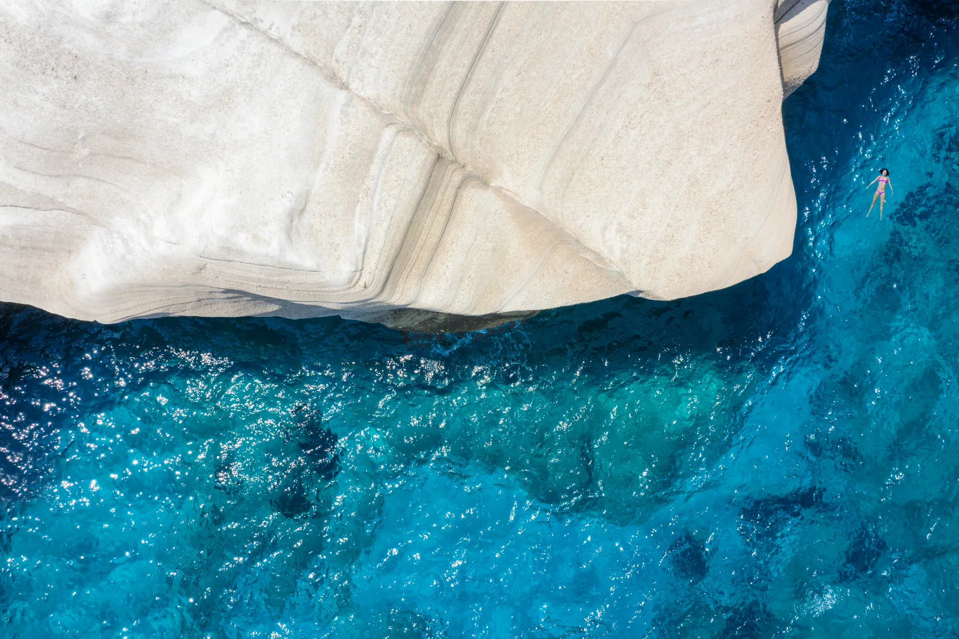 Milos sea caves from above